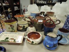 A selection of Cornish motto wares including teapot vase and mugs