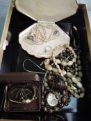 A small selection of costume jewellery including pearls, horn beads, wrist watches etc