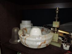 A selection of art deco and later glass light shades and an onyx style lamp base