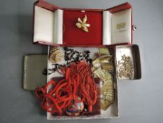 A small selection of costume jewellery including cased gold plated Singapore orchid brooch, gold