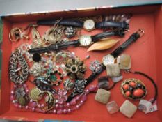 A selection of costume jewellery including brooches, watches and necklaces etc
