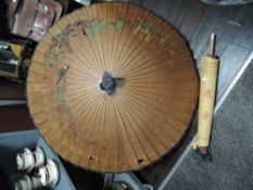 Two Chinese paper and bamboo parasols