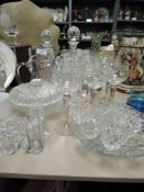 A selection of fine clear cut glass wares including pink stem and etched wine glasses