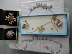 A selection of costume jewellery including leaf style necklaces