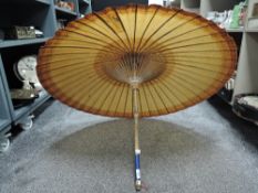 A vintage Chinese bamboo and paper sun parasol