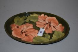 A late 20th century Moorcroft Pottery tray, of oval form2, tube-lined in the Hubiscus pattern