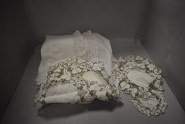 An early 20th century cotton single bed throw with crochet edging, sold together with some