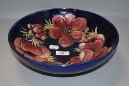 A vintage Moorcroft fruit bowl having deep blue gound with Anemone design