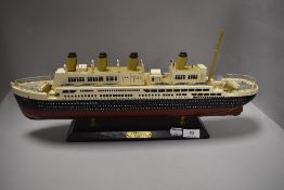 A wooden model of the Titanic.