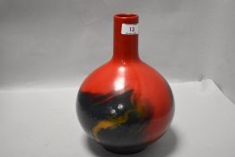 A Royal Doulton 'flambe Veined' bottle vase, with swirled design, marked as a factory second, number