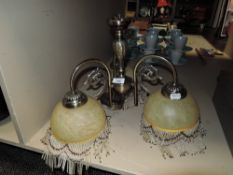 An art deco styled ceiling light with shades.