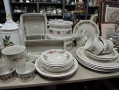 A selection of dinner and table wares by Wedgwood in the Quince design