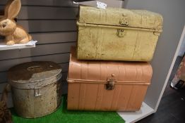 Two vintage tin trunks and a tin hat box.