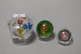 A large facet-cut lamp-work paperweight, together with a smaller lamp-work paperweight and