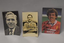 A group of three signed football related facsimile photographs, Alan Kennedy, Billy Wright