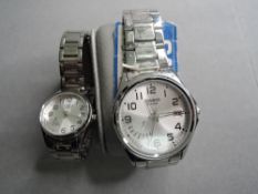 A his and hers pair of Casio day date wrist watches no: 5308 & 5337, both having Arabic numeral