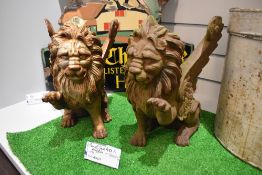 A pair of imposing heavy cast iron Griffins.