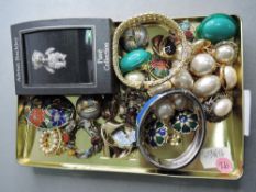 A small selection of costume jewellery including 1980's style enamelled and pearl clip earrings,