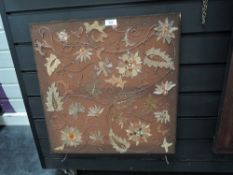 An early 20th century embroidery of felt, using metallic and threads.AF