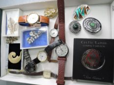 A selection of costume jewellery including watches and brooches etc