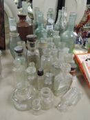 A selection of glass advertising bottles of local interest