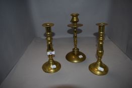 Three brass candle sticks.