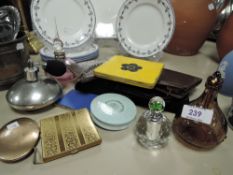 A selection of ladies perfume bottles and make up compacts