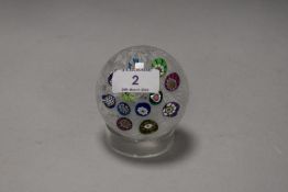 A Perthshire scattered milliefiori glass paperweight, with signature and date cane 1970