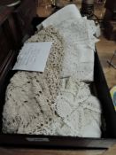 A collection of vintage and antique table linen including damask napkins and tray cloths, table