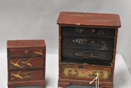 Two small Oriental lacquered jewellery chests, some damage