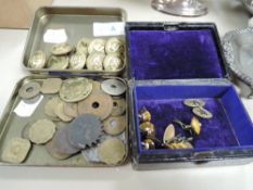 A selection of brass military buttons, tokens, coinage and tigers eye cufflinks