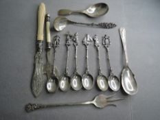 A small selection of silver plated flatware including Dutch style spoons, pickle fork etc