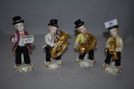 Four musician figurines marked 'N' Dresden to underside.