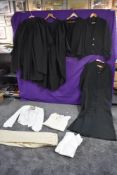 A selection of gents vintage and antique clothing including clerical gowns, naval, Scottish