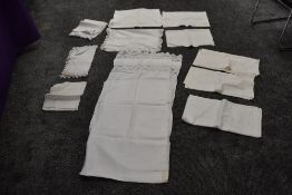 A mixed collection of intricate nightdress cases, pillow cases, bolster cases and huckaback towels.