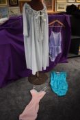 A selection of vintage nylon lingerie including all in ones and vest and a peignoir,some still