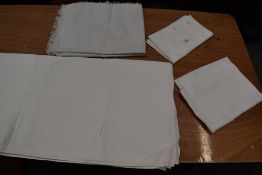 Three antique tables cloths including damask and embroidered examples, also a small throw or cover