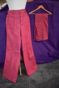Two pairs of unworn 1970s bell bottom jeans in cerise pink.