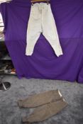 A vintage set of gents knee britches in beige wool, and a set of white polo or similar jodhpurs,