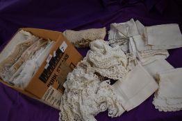 A selection of vintage and antique neutral toned tray and table cloths, crotchet and similar,