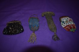 Four antique coin purses including early Victorian beaded example.