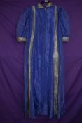 A 1930s purple taffetta house coat, having long zip to front(thought to be a later addition) and