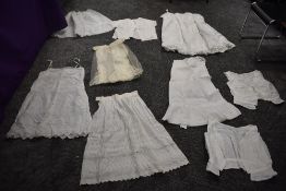 A collection of Victorian petticoats and similar, also a 1950s blouse and a childrens gown in fine