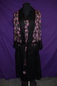 A stunning 1920s silk day dress with vibrant rose patterned sections and belted waist, also included