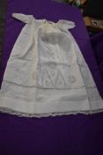 A fine cotton Victorian christening dress having delicate embroidery.
