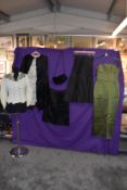 A mixture of vintage and antique clothing including cape, skirt, dress and more, musty smelling