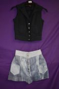A wonderful set of denim shorts and sleeveless jacket by Bus stop.