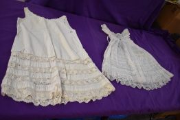 Two antique childrens dresses with beautiful techniques used throughout.