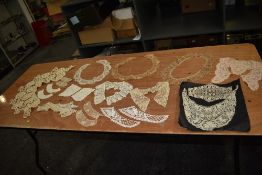 A collection of antique lace collars and similar.