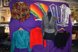 A collection of vintage and retro blouses,tops and a jacket.